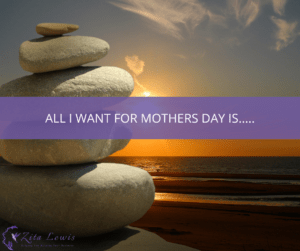 Photography of a beach at sunset with a pile of stones in the foreground and text overlayed that says All I Want for Mothers Day Is