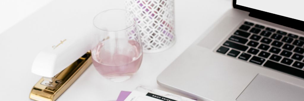 Email Management - Picture of a stapler, half empty glass and keyboard