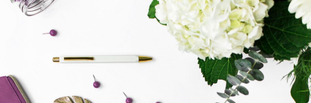 Customer Response - Picture of a pen, pins and a flower